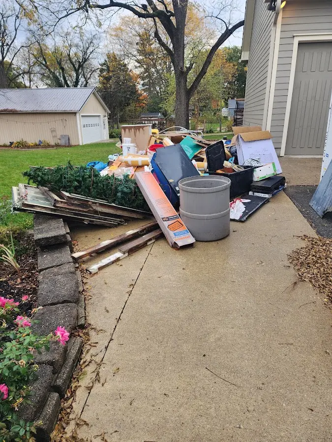 Dumpster being loaded with debris for Demolition Dumpster Rental in Hopewell